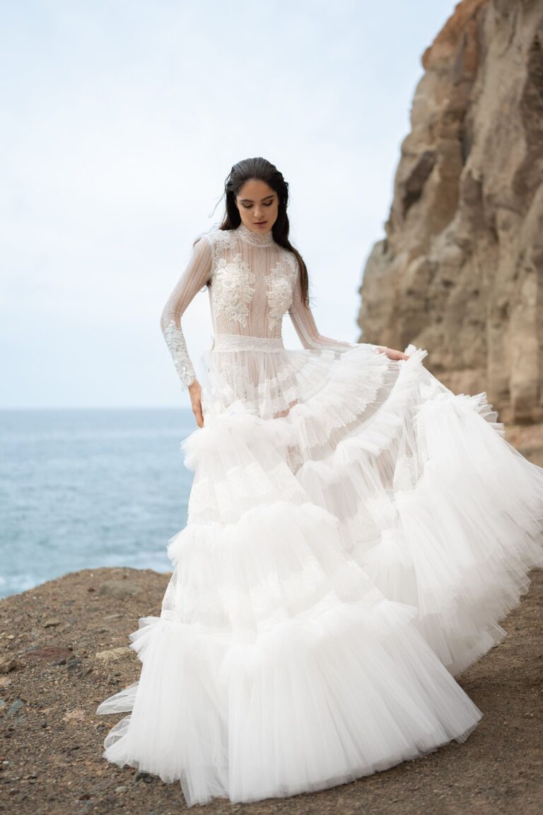 Ferdinand Atelier couture: a tiered tulle gown on a clifftop above the sea