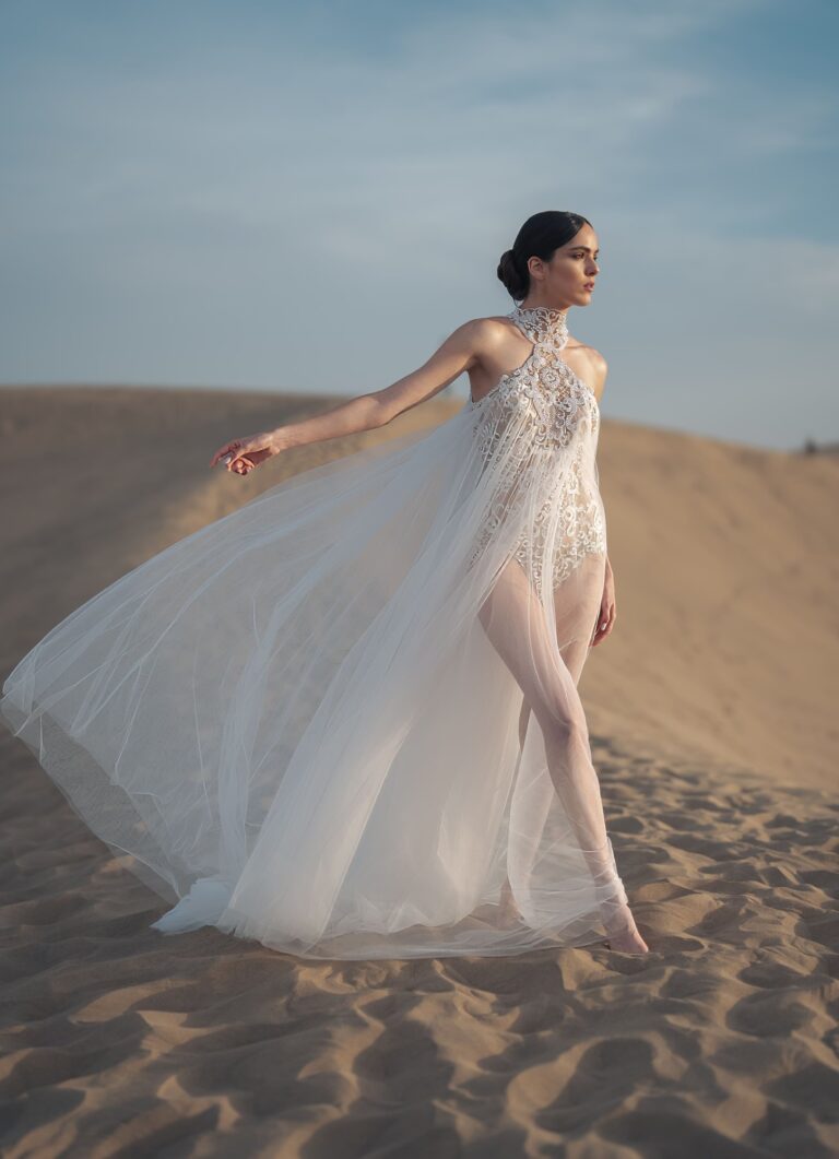 Ferdinand Atelier couture: a sheer caped gown in the dunes