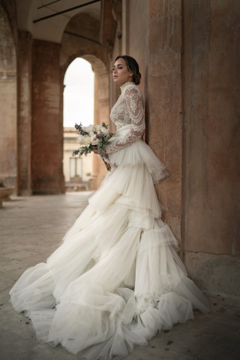 Ferdinand Atelier couture: a tiered tulle gown in a stone arcade