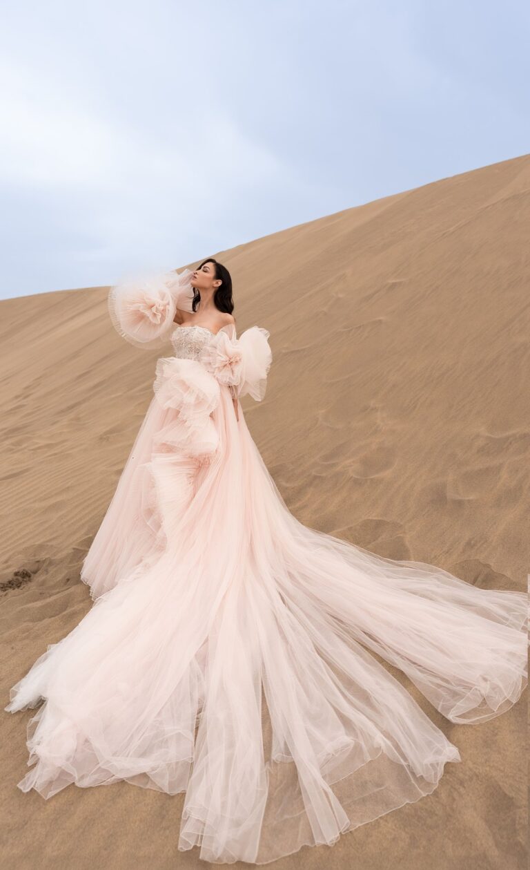 Ferdinand Atelier couture: a blush tulle gown spread across the dunes