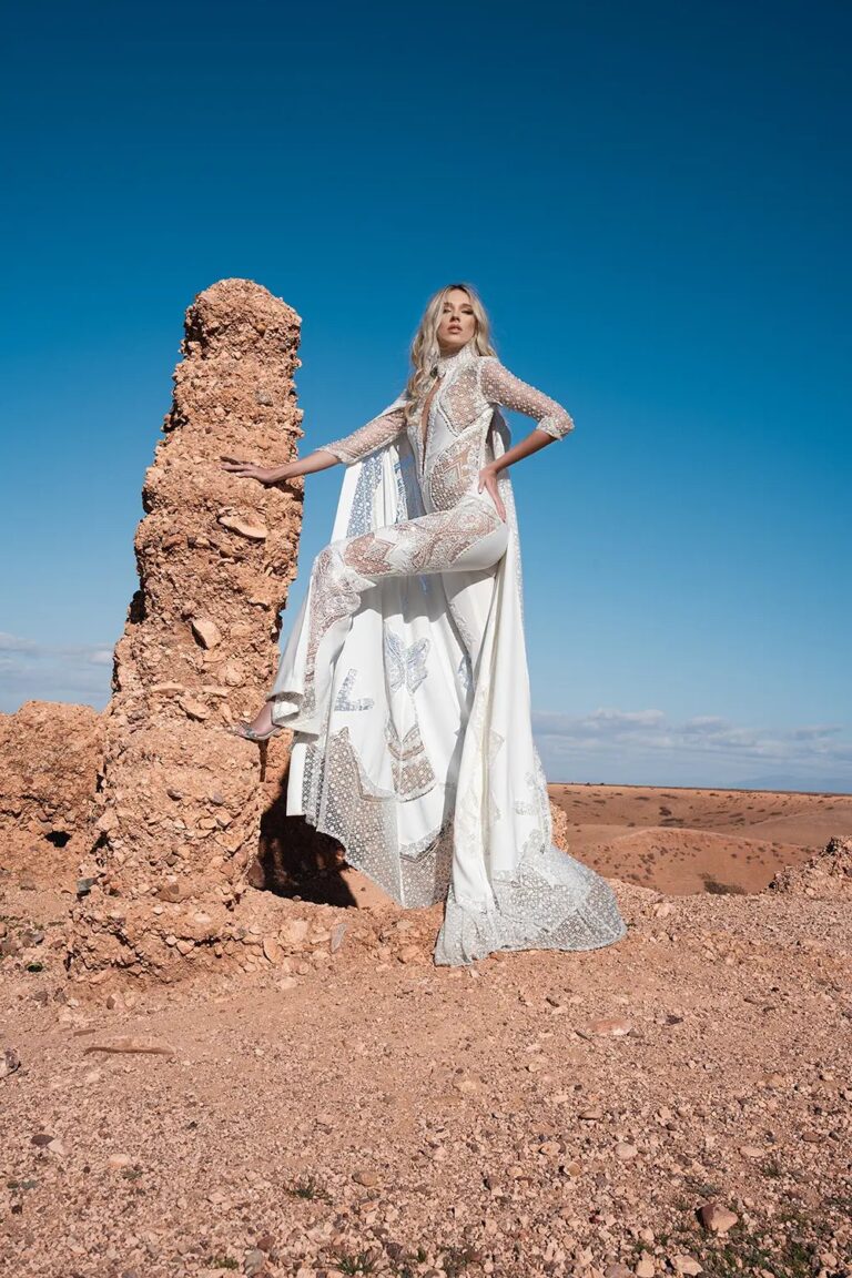 Ferdinand Atelier couture: a long-sleeved gown beside a desert ruin