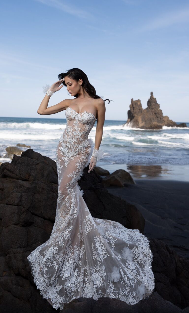 Ferdinand Atelier couture: a lace gown on volcanic rocks by the sea