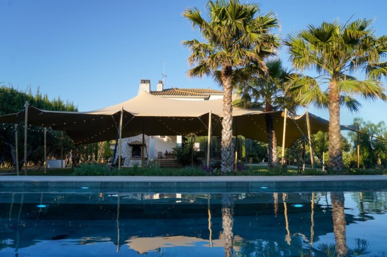 Pool terrace with stretch tent and palm trees, Finca La Concertista