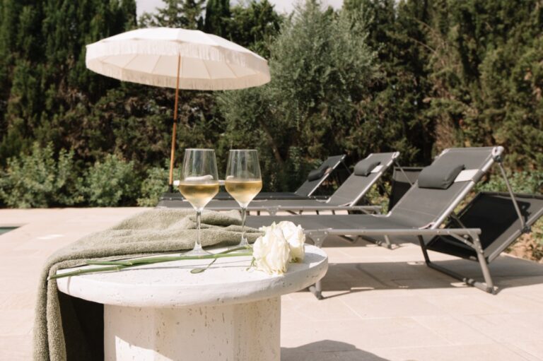 Pool terrace with sun loungers, olive trees behind, Finca La Concertista