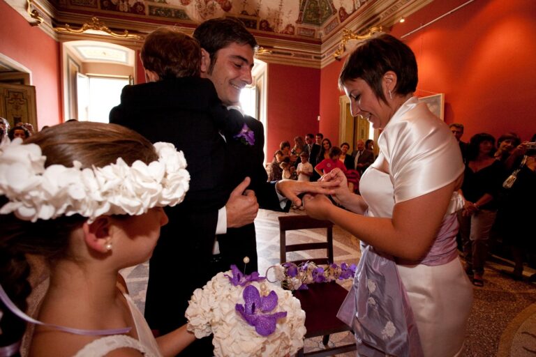Couple exchanging rings in a frescoed room, flower girl in a floral crown, Fiori Amore Fantasia