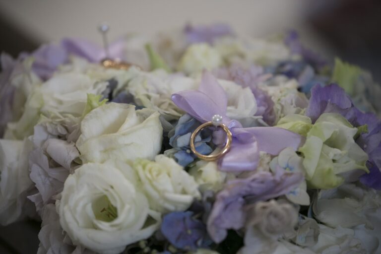 Wedding rings resting in white and lilac blooms, Fiori Amore Fantasia