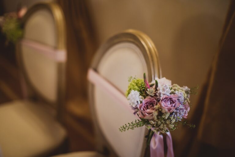 Pink and lilac posy tied to a gold-framed chair, Fiori Amore Fantasia