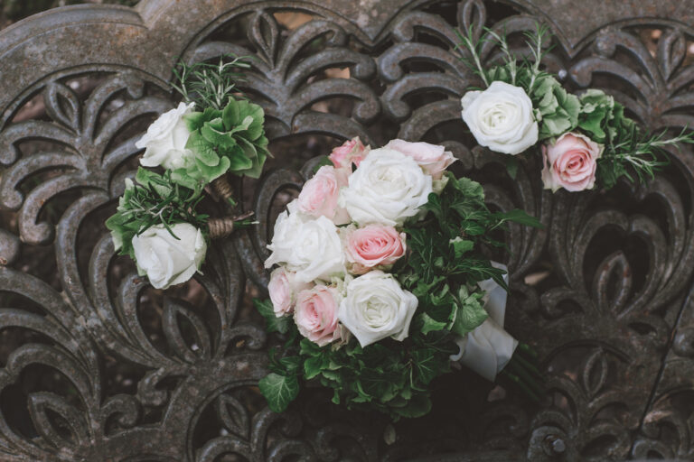 Bridal bouquet of white and pink roses on carved stone, Fiori Amore Fantasia