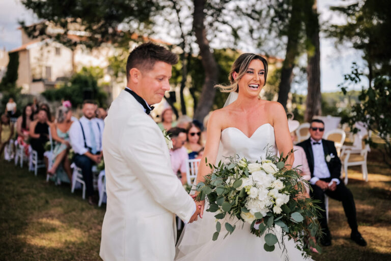 A garden ceremony under pine trees with guests looking on, Istria, Flammeum