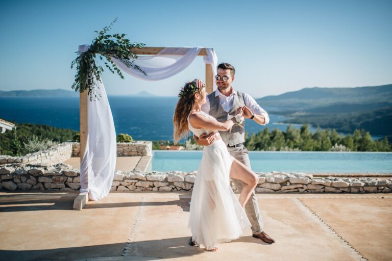 A couple at a draped arch beside an infinity pool above the sea, Istria, Flammeum