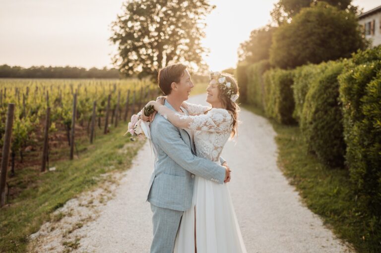 An embrace on a gravel path beside vines in golden light, Istria, Flammeum