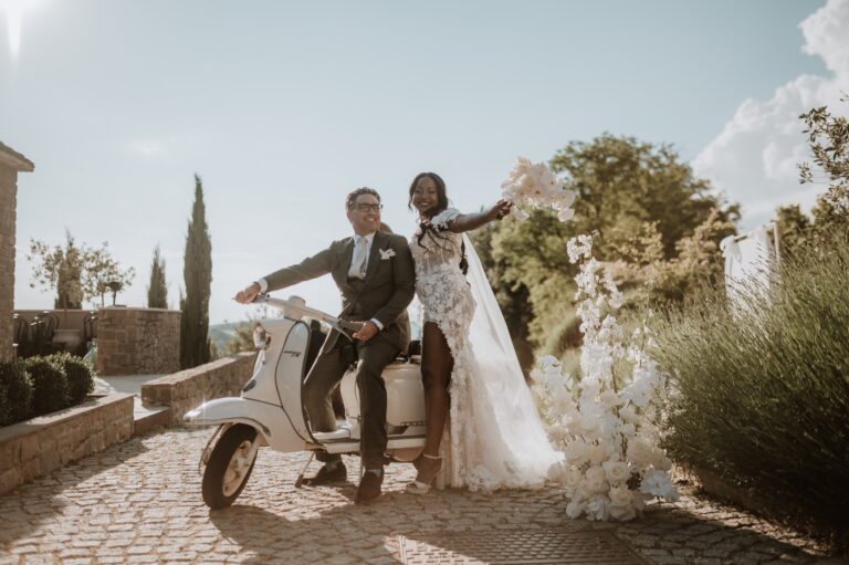 A couple on a vintage scooter in front of an Istrian stone house, Flammeum