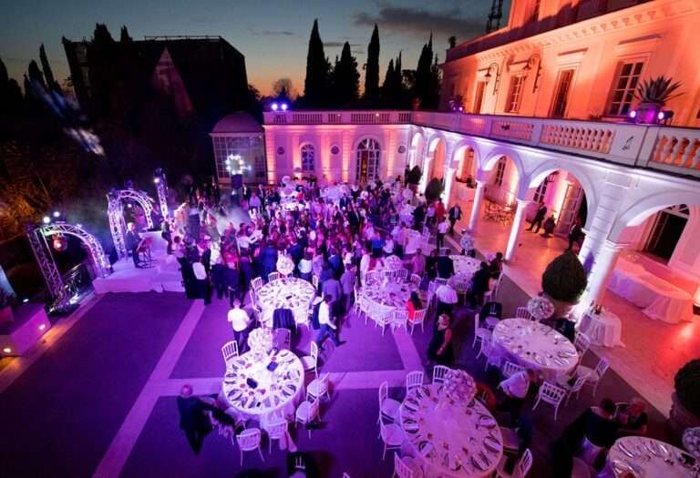 The reception in full swing beneath Villa Miani's colonnade, Flavia Bruni