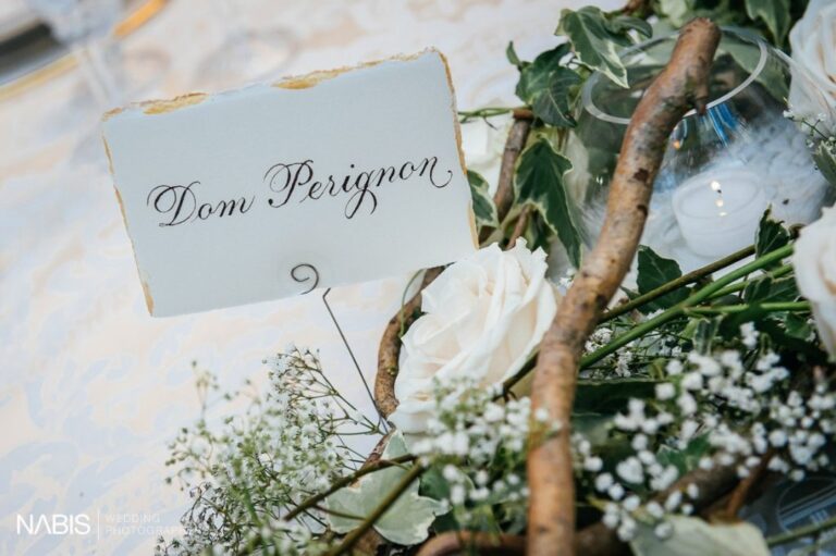 A place card reads Dom Perignon among roses and birch, Castello di Tor Crescenza, Flavia Bruni