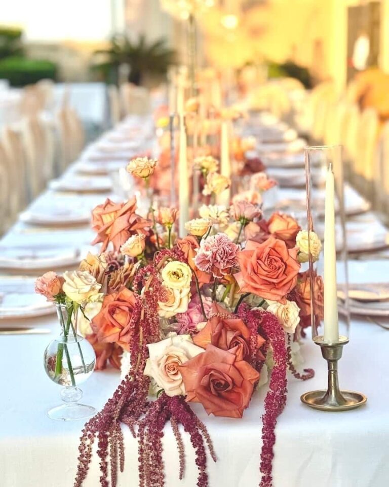 A long candlelit table dressed for dinner, La Posta Vecchia, Floreventi