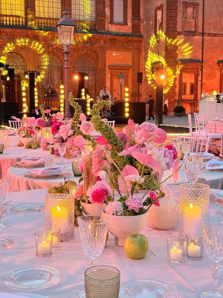 A reception beneath Villa Mondragone's illuminated facade, Floreventi