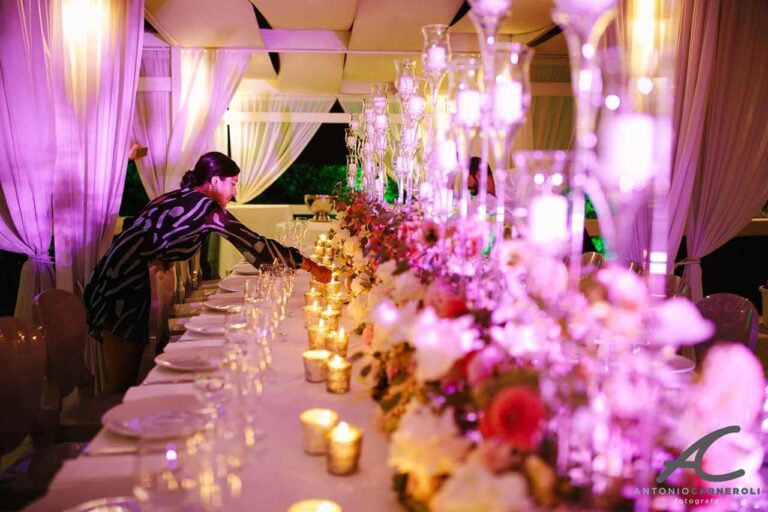 A florist dresses the table for the Karen Tran welcome dinner, Floreventi