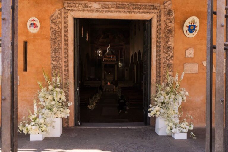 The entrance to the Church of San Giorgio in Velabro, dressed in white, Floreventi