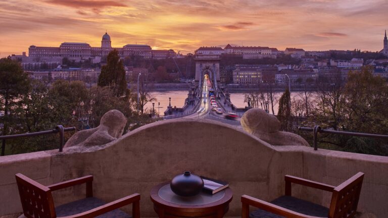 Balcony with chairs and a table above the Chain Bridge at sunset, Four Seasons Hotel Gresham Palace