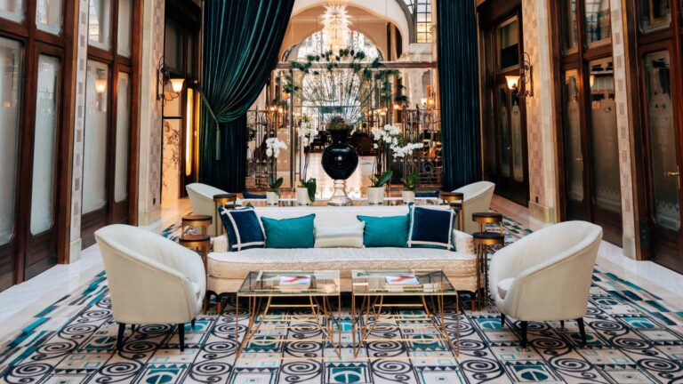 Zrínyi Passage with Zsolnay tiles, white seating and a high ceiling, Four Seasons Hotel Gresham Palace