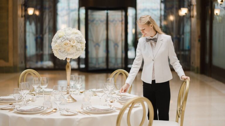 Round table laid with glassware and a floral centrepiece, Four Seasons Hotel Gresham Palace