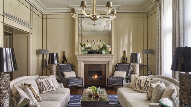 Royal Suite living room with fireplace and armchairs, Four Seasons Hotel Gresham Palace