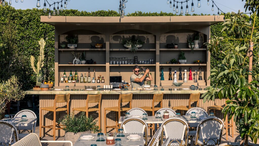 Terrace bar and seating among greenery, Four Seasons Los Angeles at Beverly Hills