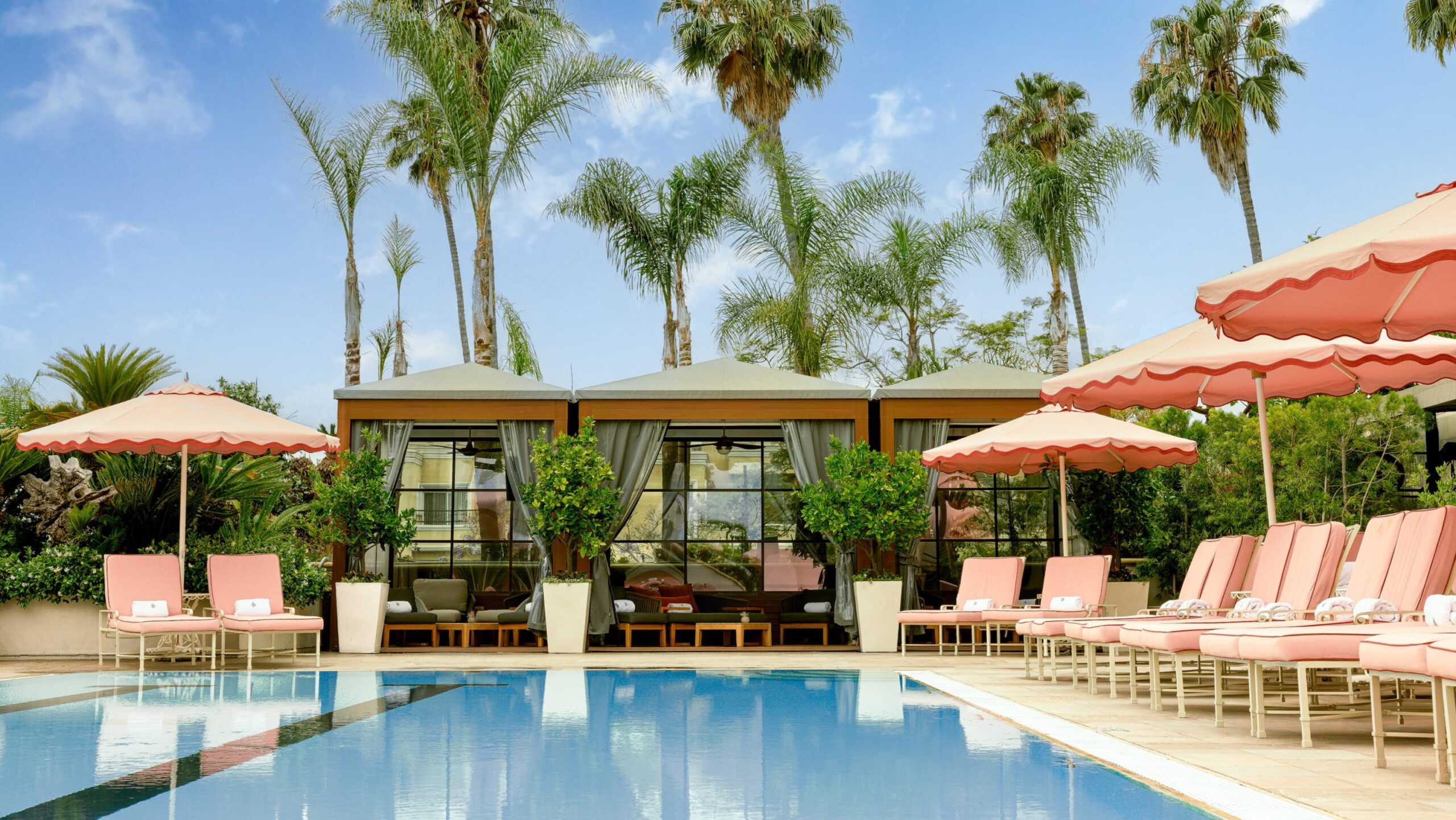 The pool, cabanas and palms on the pool terrace, Four Seasons Los Angeles at Beverly Hills