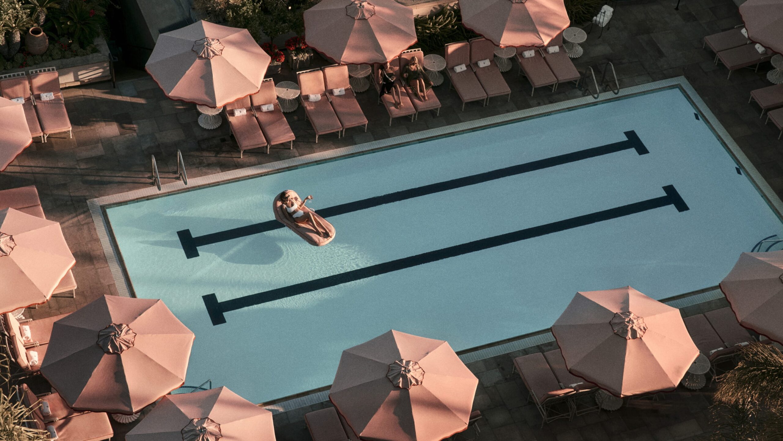 The pool and pink parasols seen from above, Four Seasons Los Angeles at Beverly Hills