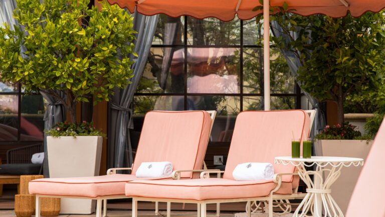 Pool loungers with white towels, Four Seasons Los Angeles at Beverly Hills