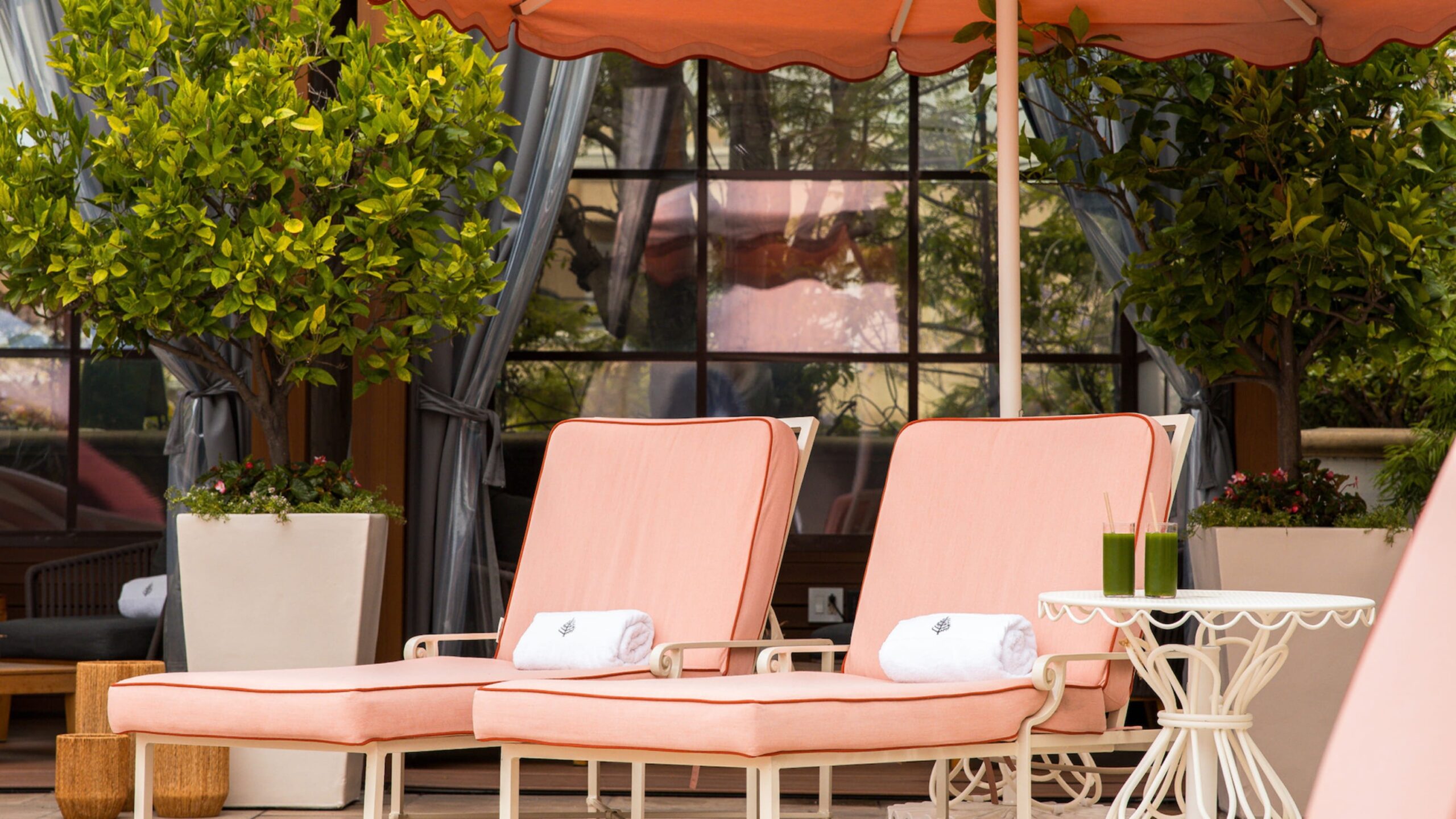 Pool loungers with white towels, Four Seasons Los Angeles at Beverly Hills