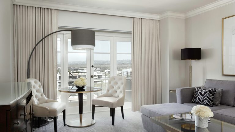Suite sitting area with floor lamp and city view, Four Seasons Los Angeles at Beverly Hills