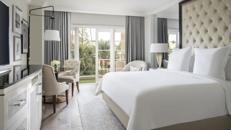 Guest room with a tufted headboard and sitting area, Four Seasons Los Angeles at Beverly Hills