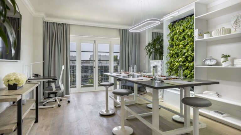 Suite with a dining table and a green wall, Four Seasons Los Angeles at Beverly Hills