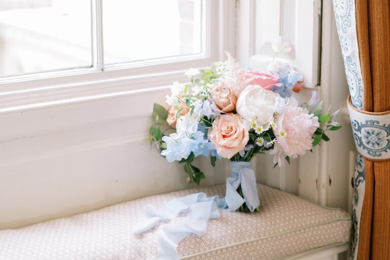 A bouquet of peony, sweet pea and delphinium, ribbon trailing, Foxgloves and Roses