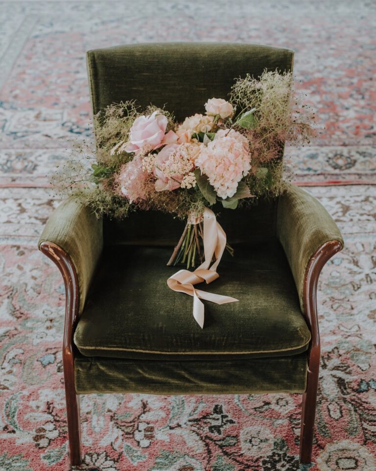 A bouquet of rose and hydrangea, on a velvet chair, Foxgloves and Roses