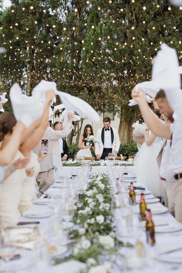 Guests form an archway for the send-off, Amy and Jonathan's wedding, Villa Dianella, Franci's Flowers Wedding Design