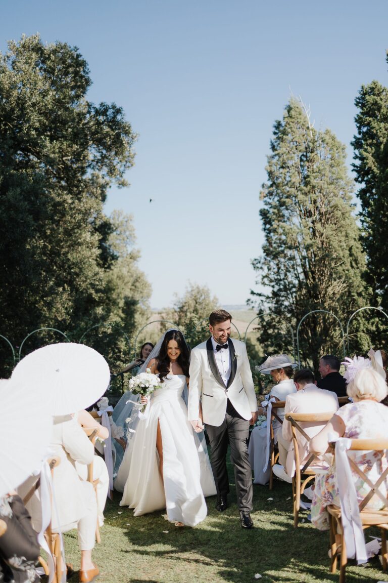 The wedding party walks a cypress path in a shower of petals, Villa Dianella, Franci's Flowers Wedding Design