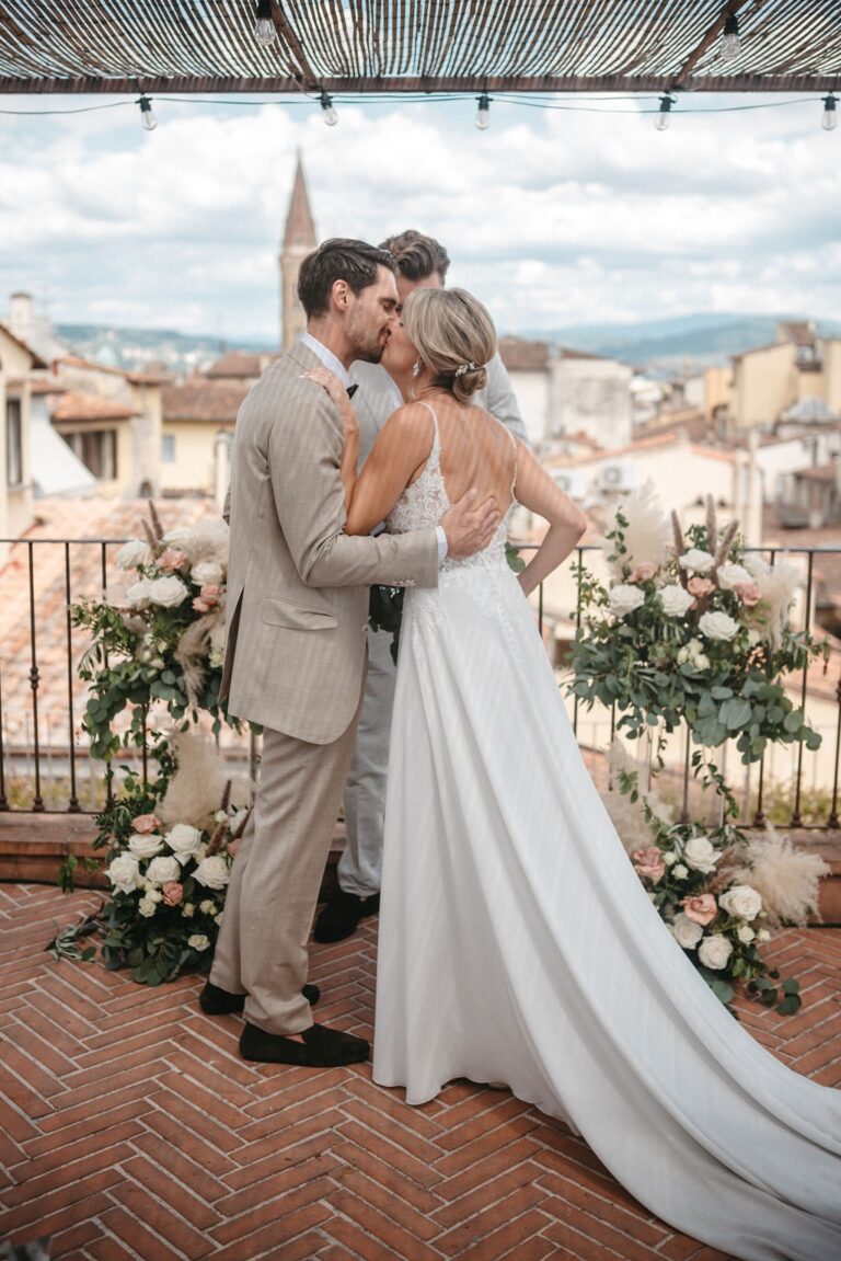 Christina and Viktor embrace on the rooftop terrace above the Florence skyline, Hotel Calimala, Franci's Flowers Wedding Design