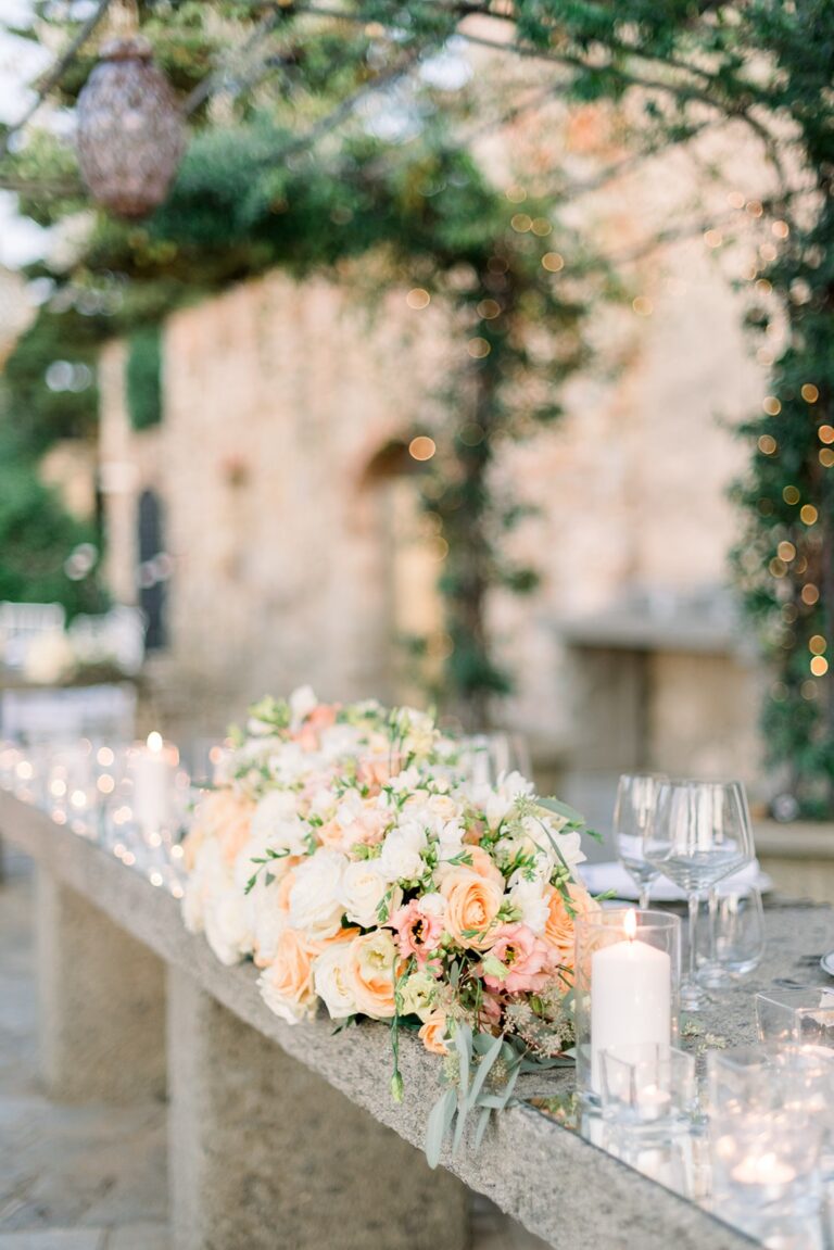 A peach and cream sweetheart table dressed on a stone balustrade, Castello di Segalari, Franci's Flowers Wedding Design