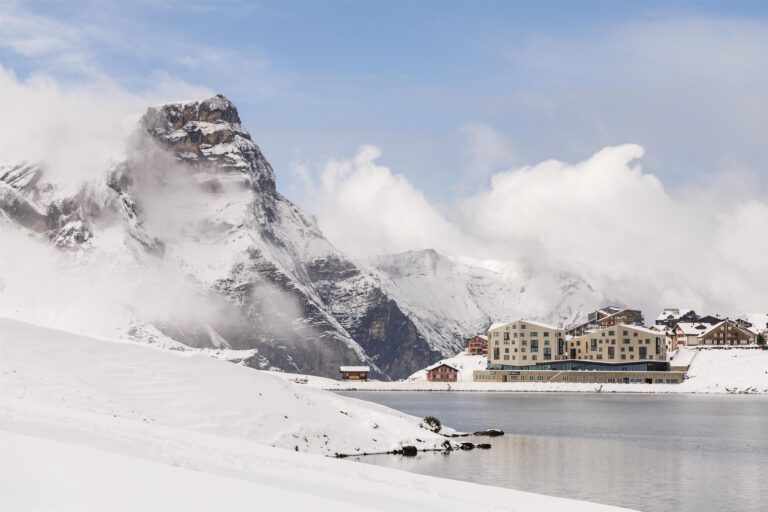 The resort across the frozen lake in winter, Frutt Mountain Resort