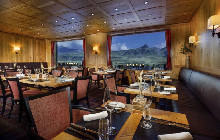 A dining room with mountain-view windows, Frutt Mountain Resort