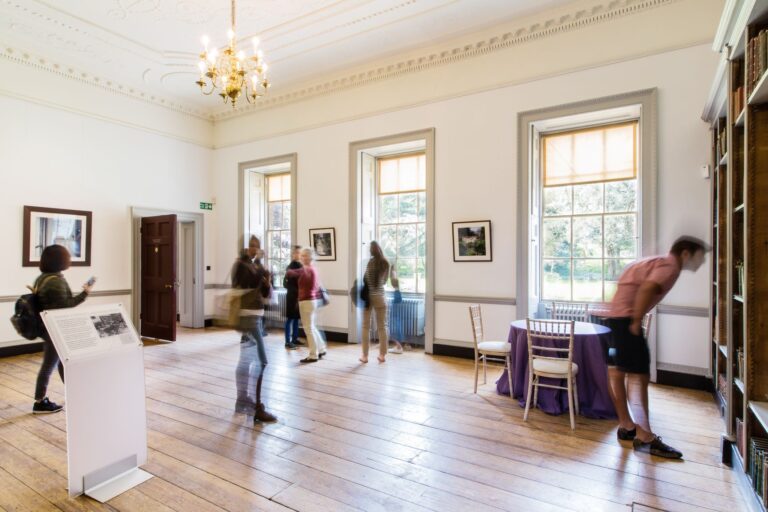 The Bishop Terrick Rooms, bright and high-windowed over a wooden floor, Fulham Palace