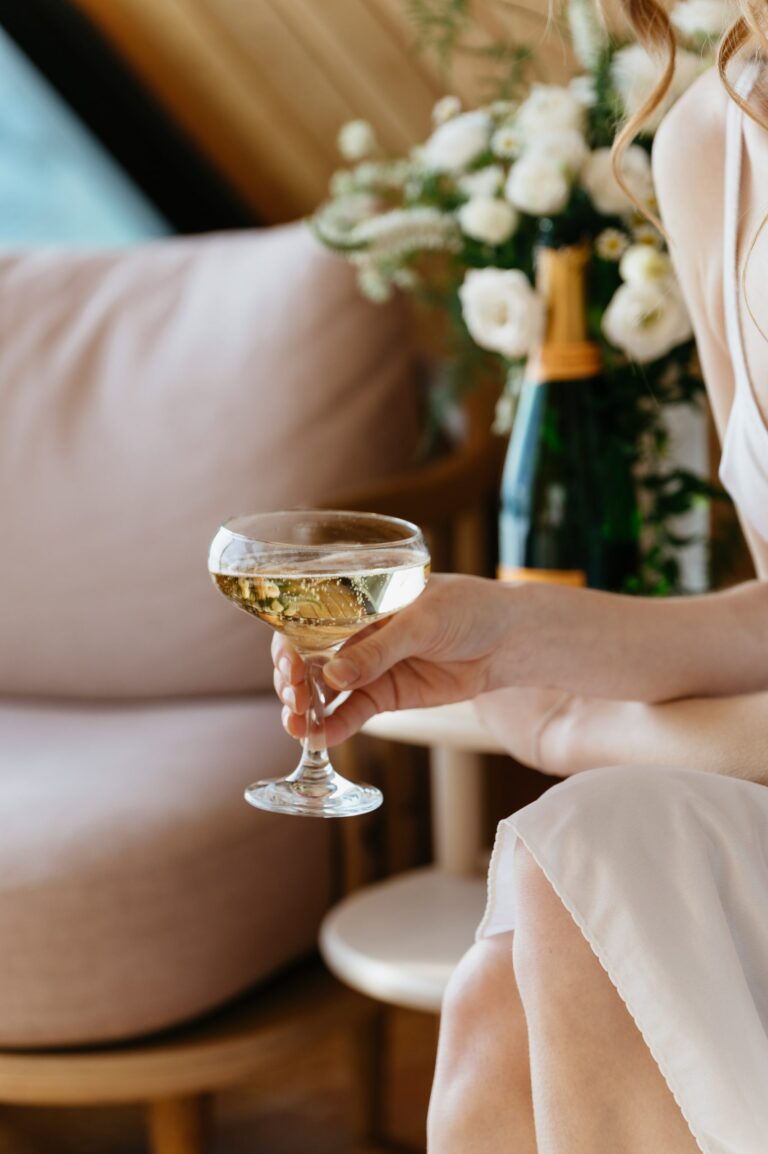 A glass of champagne and white flowers during bridal preparations, Gaetano Di Giacomo Media Production