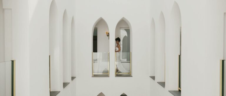 A bride framed by white arches at Palazzo Avino, Ravello, from an editorial styled shoot on the Amalfi Coast, Gaetano Di Giacomo Media Production