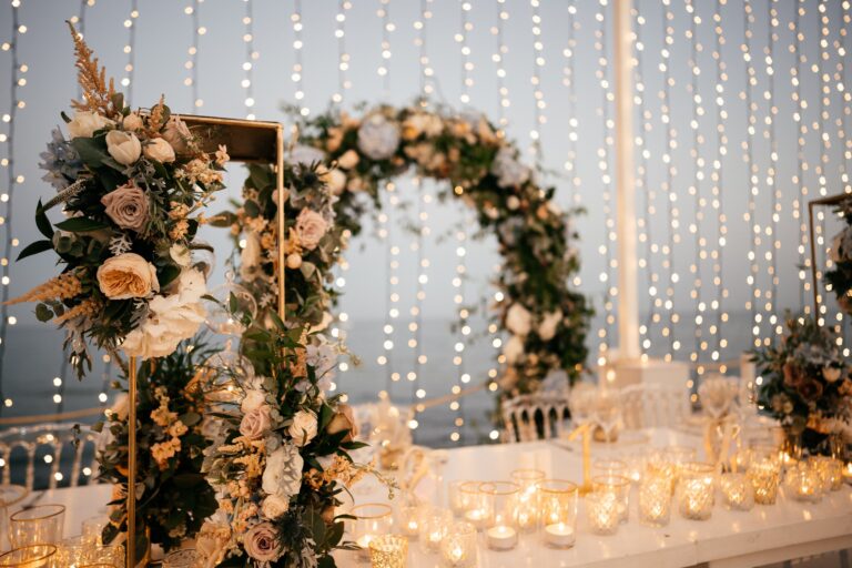 Floral arches and candles at the top table, Galu Seaside