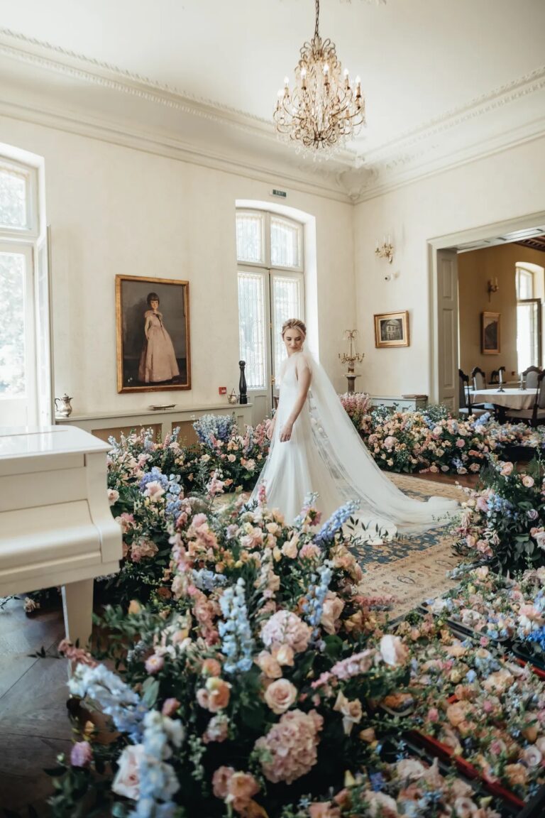 Bride in a salon filled with pastel flowers, Geta Ungurean Agency