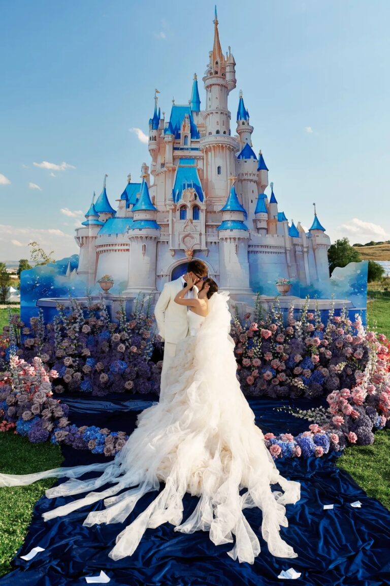 Bride in front of a sculpted blue fairytale castle set, Geta Ungurean Agency