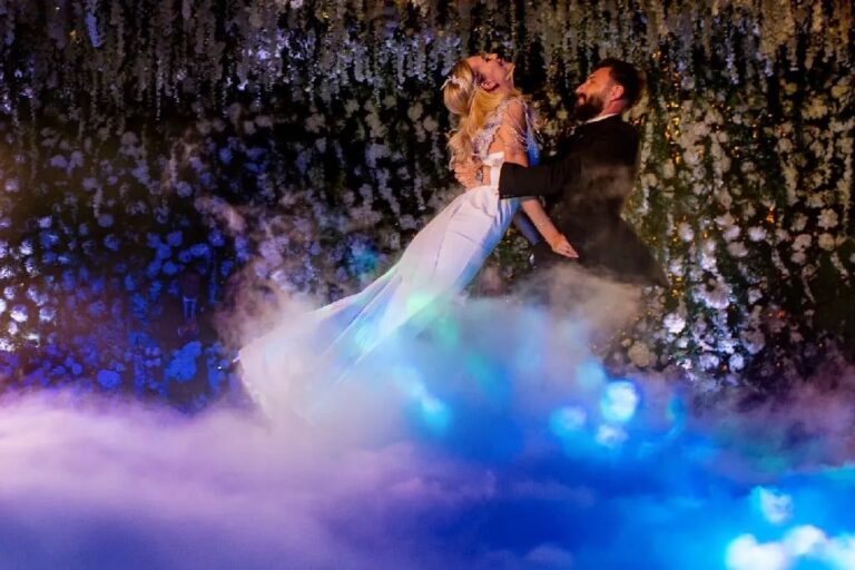 First dance beneath a hanging floral ceiling, wreathed in low fog, Geta Ungurean Agency