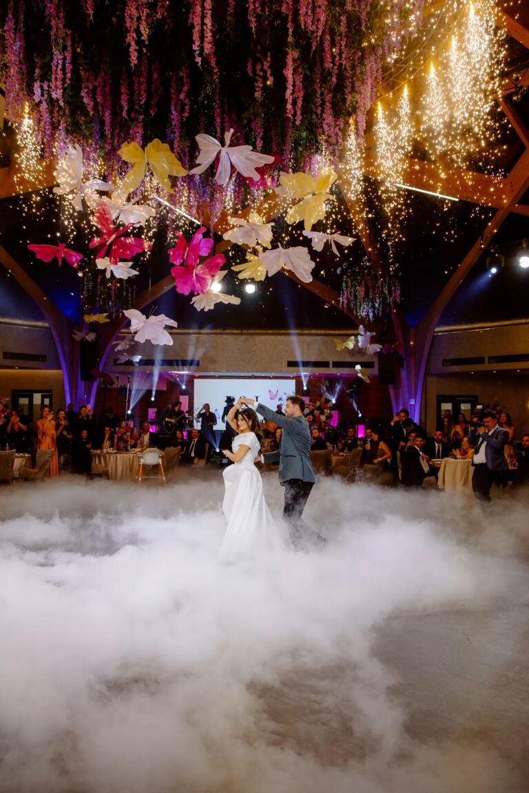 First dance in a ballroom under hanging blooms and butterflies, Geta Ungurean Agency
